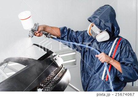 worker painting a car black blank parts in special 25674067