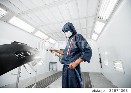 worker painting a car black blank parts in special 25674068