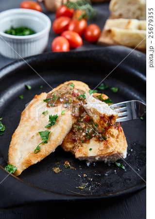 Chicken chops with sauce of cognac, broth, capers 25679355
