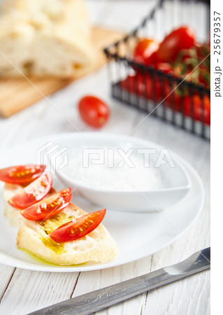 Vegetarian sandwich with olive oil, cherry tomato 25679357