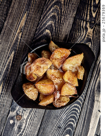 Baked potato wedges with garlic, christmas garnish 25679369