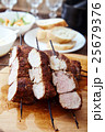 Skewered meat or shish kebabs of pork in marinade 25679376