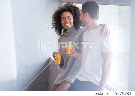 Beautiful girl putting hand around her lovely 25679733