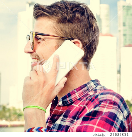 Young Man Outdoors Talking Smartphone Concept 25685351