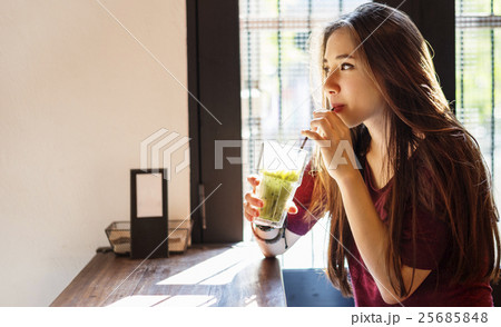 Young Woman Drinking Tea Concept Young Woman Drinking Tea Concept 25685848