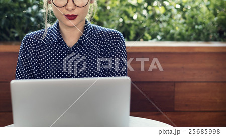 Woman Sitting Alone Using Laptop Concept 25685998