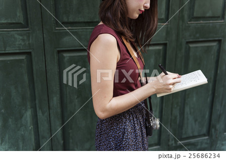 Woman Making Notes Outside City Concept Woman Making Notes Outside City Concept 25686234