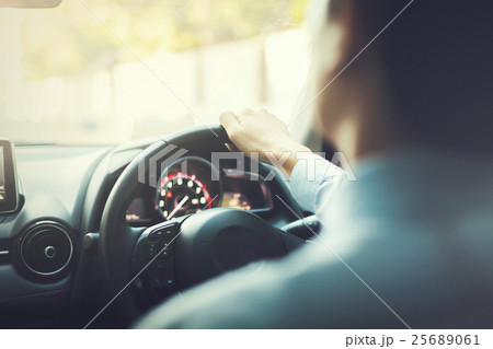 Close-up of Young man driving on the road vintage 25689061