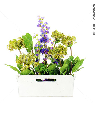 Composition of artificial garden flowers in decorative vase  25689620