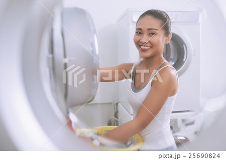 Loading laundry Loading laundry 25690824