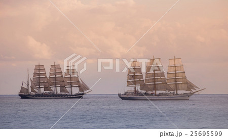 Vintage sailboats at sunset in sea Vintage sailboats at sunset in sea 25695599