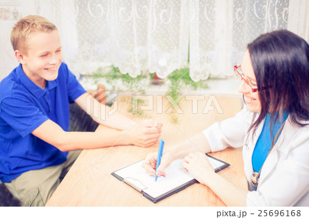 doctor hands giving pair of contact lens 25696168