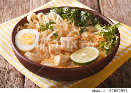 Malaysian laksa soup with chicken close up Malaysian laksa soup with chicken close up 25696948