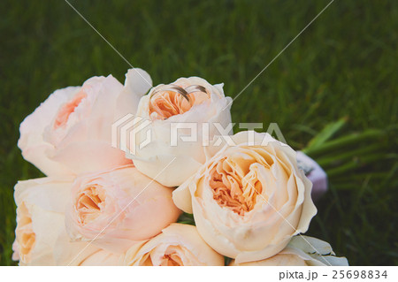 wedding bouquet of the bride at the grass. 25698834