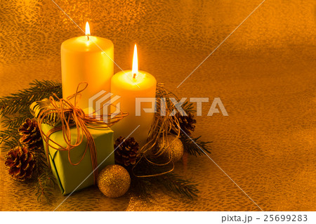 Burning white Christmas candles 25699283