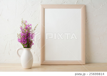 Frame mockup with purple wild flowers bouquet 25699814