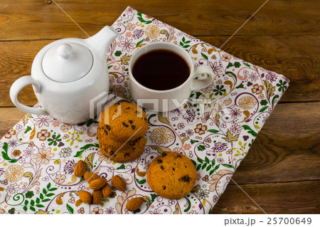 Breakfast tea, teapot and cookies Breakfast tea, teapot and cookies 25700649