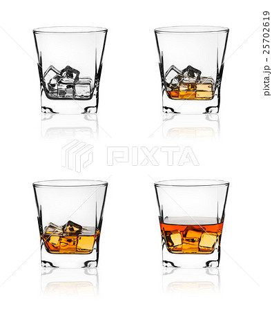 Glass of scotch whiskey and ice Glass of scotch whiskey and ice 25702619