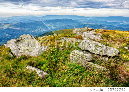 stones in valley on the edge of mountain range stones in valley on the edge of mountain range 25702742