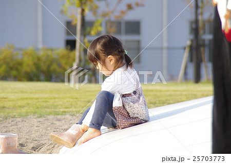 長靴をはく少女の写真素材