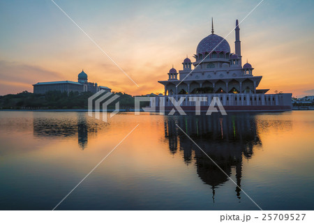Beautiful Sunrise over a Mosque by the lake Beautiful Sunrise over a Mosque by the lake 25709527