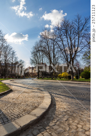 cobbled street winds through old town 25711123