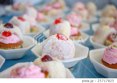 Donut and cup cake on table 25717825