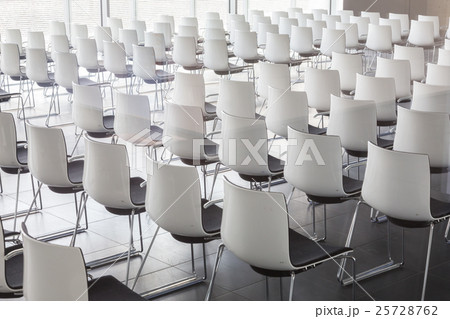 Empty white chairs in contemporary conference hall Empty white chairs in contemporary conference hall 25728762