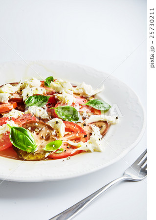 Italian caprese, mozzarella, tomatoes, basil 25730211