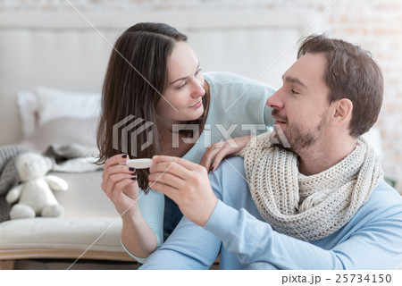 Pleasant delighted couple looking at each other 25734150