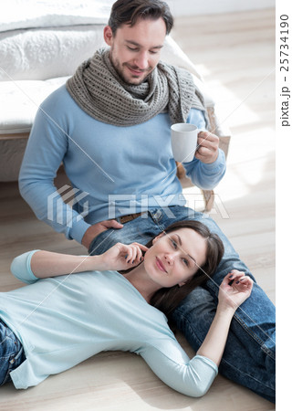 Handsome cheerful man looking at his girlfriend Handsome cheerful man looking at his girlfriend 25734190