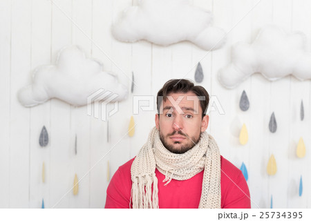 Sad cheerless man looking sadly in front of him Sad cheerless man looking sadly in front of him 25734395
