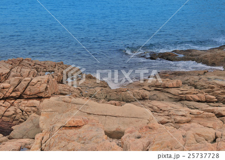 rocky sea coast and blurred water in shek o 25737728