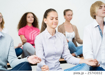 group of young people meditating group of young people meditating 25743032