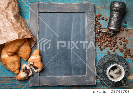 Fresh croissants and coffee Fresh croissants and coffee 25745703