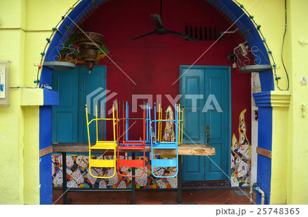 Colorful chairs on a wooden table 25748365