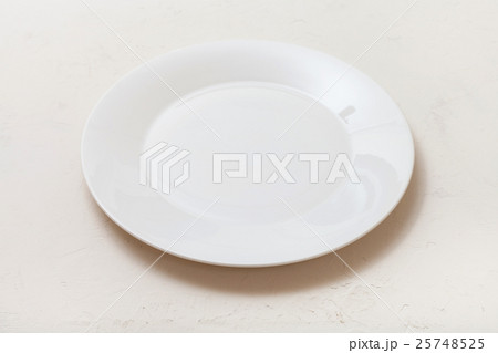white plate on white plastering board 25748525