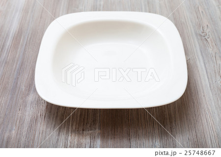 white bowl on gray brown board 25748667