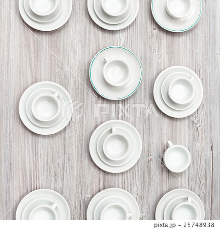 top view of several cups and saucers on gray table top view of several cups and saucers on gray table 25748938