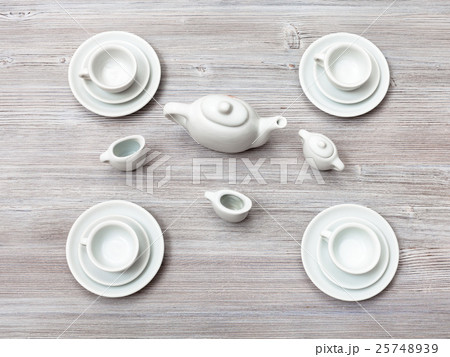 top view of tea set on gray brown table 25748939