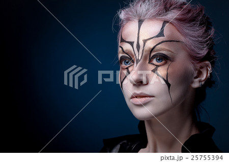 Creative portrait of a girl on a black background 25755394