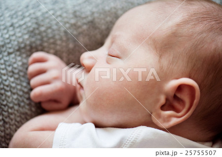 Newborn baby boy lying on bed, sleeping, close up 25755507