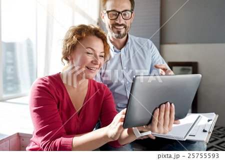 Woman using tablet with her husband 25755593