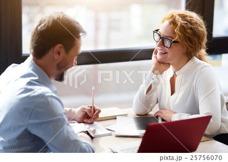 Middle-aged couple working on laptop and taking 25756070