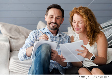 Middle-aged man and woman couple making notes 25756167