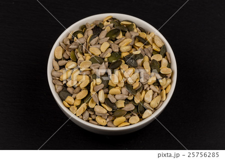 mixed seeds in wooden bowl 25756285
