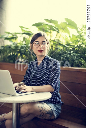 Woman Sitting Alone Using Laptop Concept 25765795