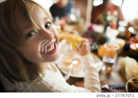 Little Girl Eating Corn Thanksgiving Celebration Concept Little Girl Eating Corn Thanksgiving Celebration Concept 25767051