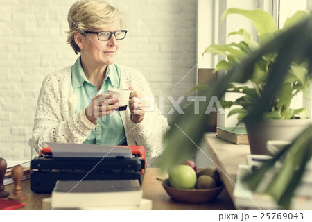 Senior Adult Using Typerwriter Typing Concept Senior Adult Using Typerwriter Typing Concept 25769043