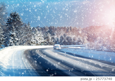 Car tires on winter road 25773740